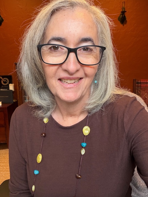 Sarah Auerswald in brown shirt